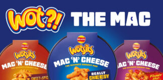 Packs of Wotsits Mac N Cheese variants including Mac N Cheese Really Cheesy flavour, Mac N Cheese Flamin' Hot and Mac N Cheese Sweet & Spicy. The three variants are against a blue background with text at the top reading 'Wot?! The Mac'.