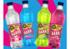 Promotional image of Barr Flavours with the Jurassic World Rebirth promotion on pack featuring flavours Cream Soda, Bubblegum, Limeade and Cherryade with a blue and pink background.