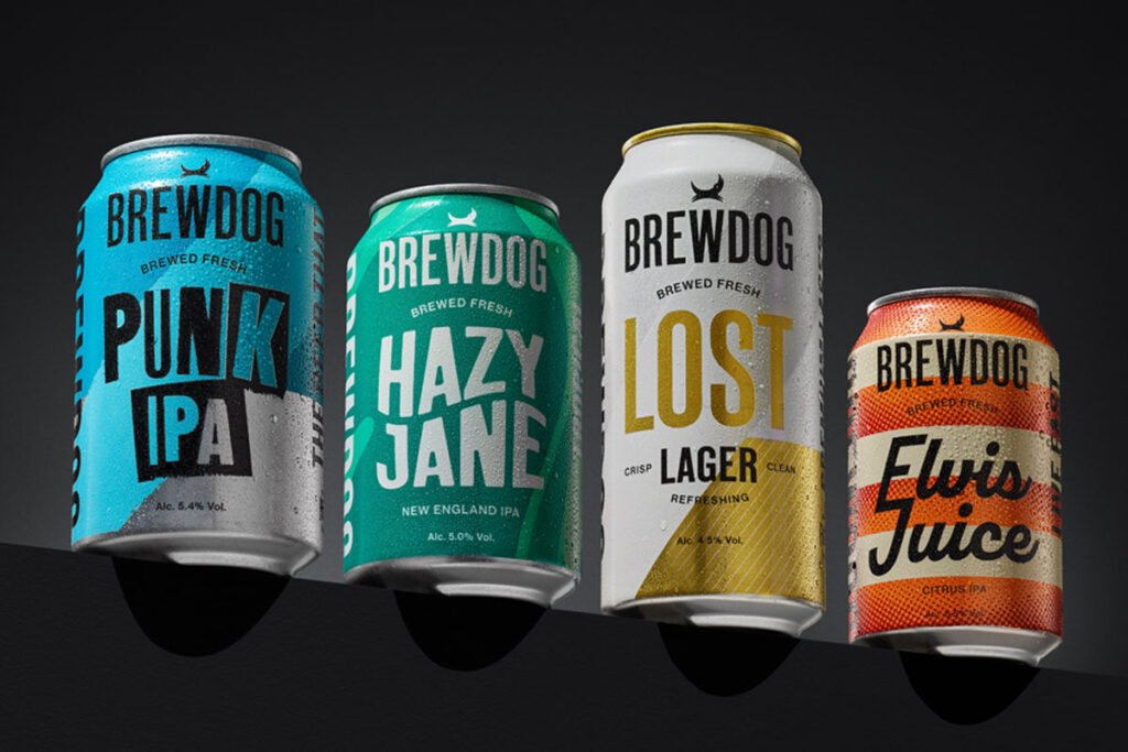 Pack shots of the 2025 rebrand for BrewDog including Punk IPA, Hazy Jane, Lost Lager and Elvis Juice. The four cans are stacked on a black platform against a black background.