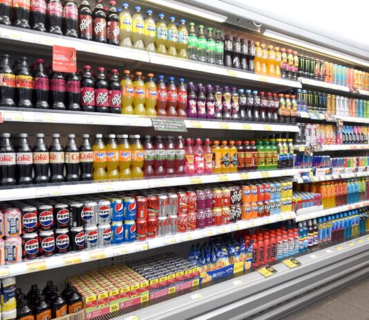 Inflation spikes upwards to 4.1% A range of soft drinks sitting in chillers in a store.