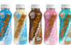Pack shots of Grenade Protein Shakes including (left to right) Cookies & Cream, White Chocolate, Fudge Brownie, Strawberries & Cream and Chocolate Salted Caramel.