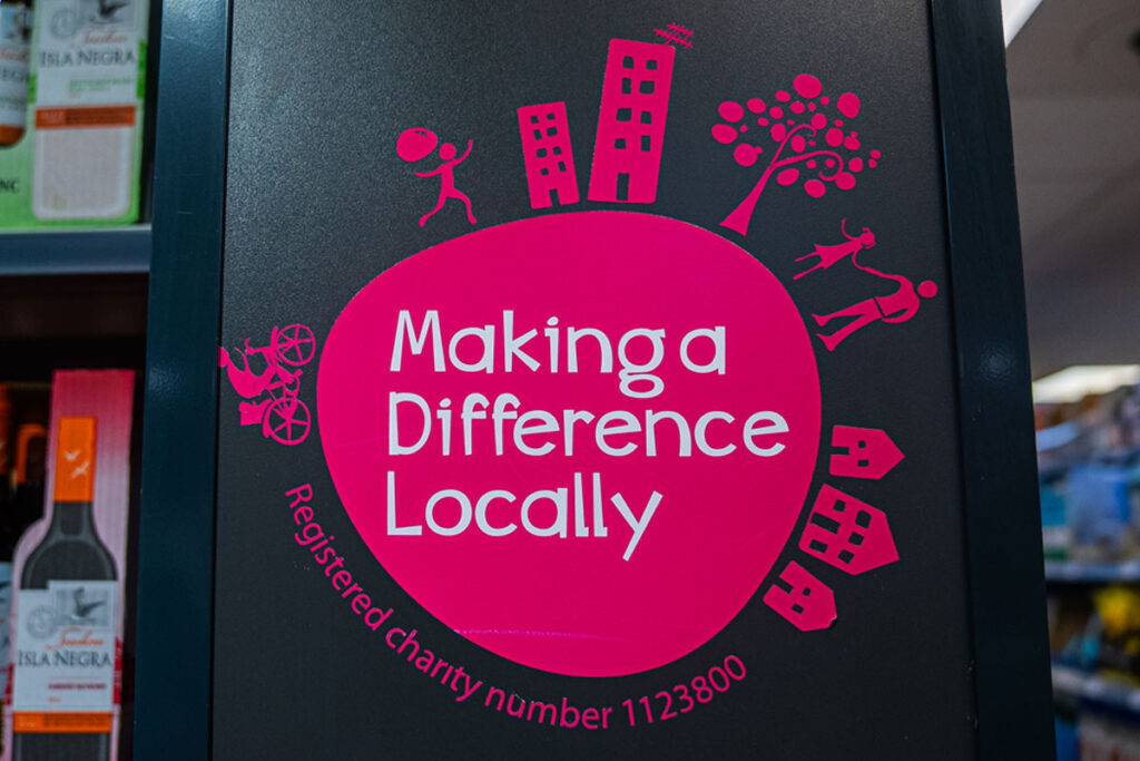Co-op Wholesale's Making a Difference Locally logo inside a store.