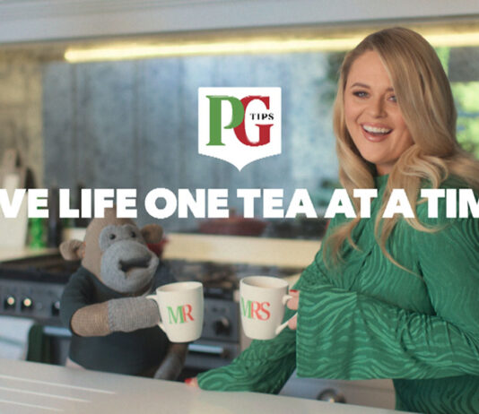 PG Tips Monkey returns to TV screens The PG Tips Monkey mascot with comic actor Emily Atack stand in a kitchen with Mr and Mrs Mugs as they go to clink them together. The PG Tips logo is on top of the image with text that reads 'LIVE LIFE ONE TEA AT A TIME'.