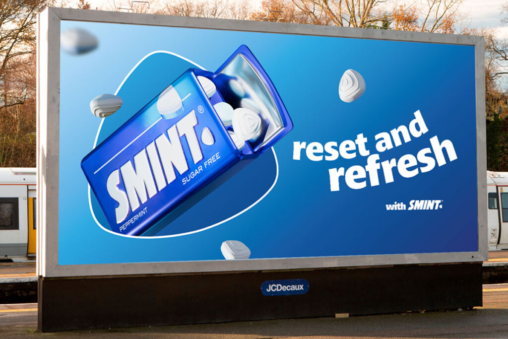A billboard at a train station with the Smint summer campaign 2025 on it. The tagline reads 'Reset and Refresh'.