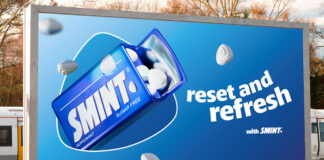 A billboard at a train station with the Smint summer campaign 2025 on it. The tagline reads 'Reset and Refresh'.