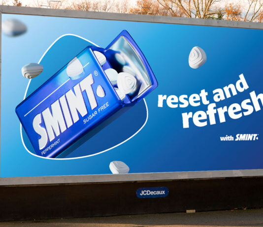 A billboard at a train station with the Smint summer campaign 2025 on it. The tagline reads 'Reset and Refresh'.