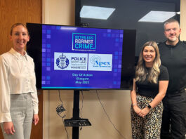 Retailers Against Crime takes action in Glasgow city centre Members from Retailers Against Crime and Police Scotland stand around a TV screen to mark the Day of Action Glasgow May 2025.
