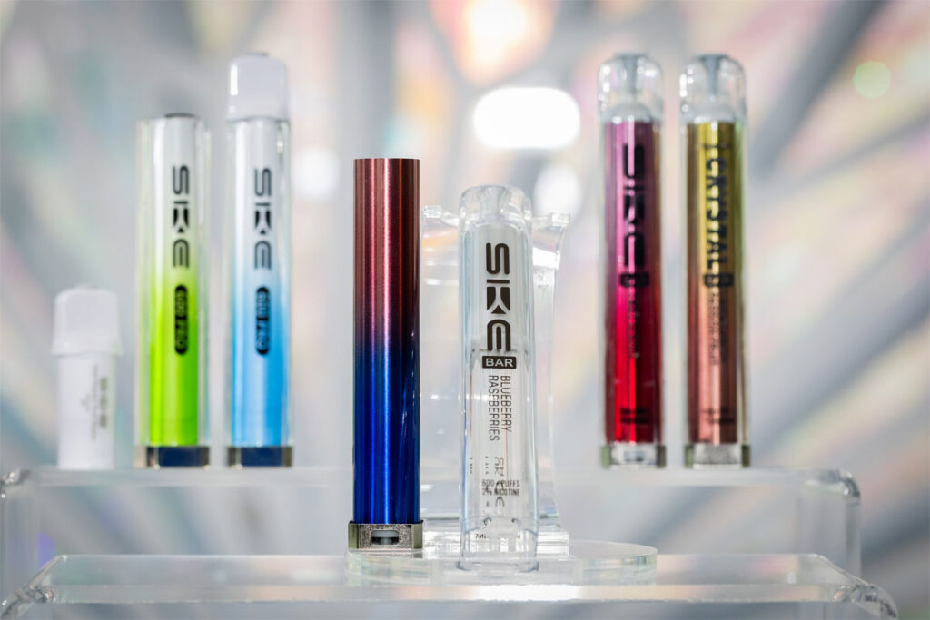 SKE Crystal vape devices are lined up on a display with a crystal design in the background.