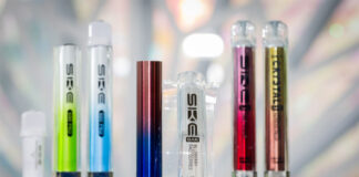 SKE Crystal vape devices are lined up on a display with a crystal design in the background.