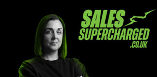 Glasgow retailer Natalie Lightfoot stands against a black background with green lighting shining down on her head with the SalesSupercharged.co.uk logo in the top right corner.