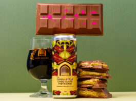 Vault City brews into Dubai chocolate trend with new stout beer A can of Vault City Dubai Style Chocolate Pistachio Imperial Pastry Stout stands on a table with a chocolate bar balanced on top of the can, a glass with the stout inside it to the left of the image and bars of Dubai-Style Chocolate piled up to the right of the can.