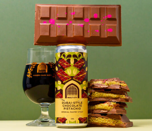 Vault City brews into Dubai chocolate trend with new stout beer A can of Vault City Dubai Style Chocolate Pistachio Imperial Pastry Stout stands on a table with a chocolate bar balanced on top of the can, a glass with the stout inside it to the left of the image and bars of Dubai-Style Chocolate piled up to the right of the can.