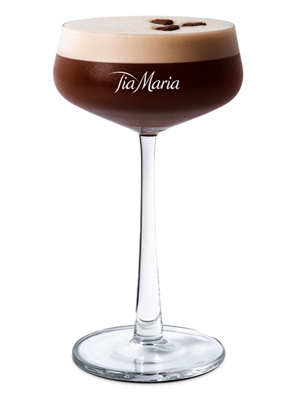 An Espresso Martini cocktail served in a Tia Maria branded coupe glass.