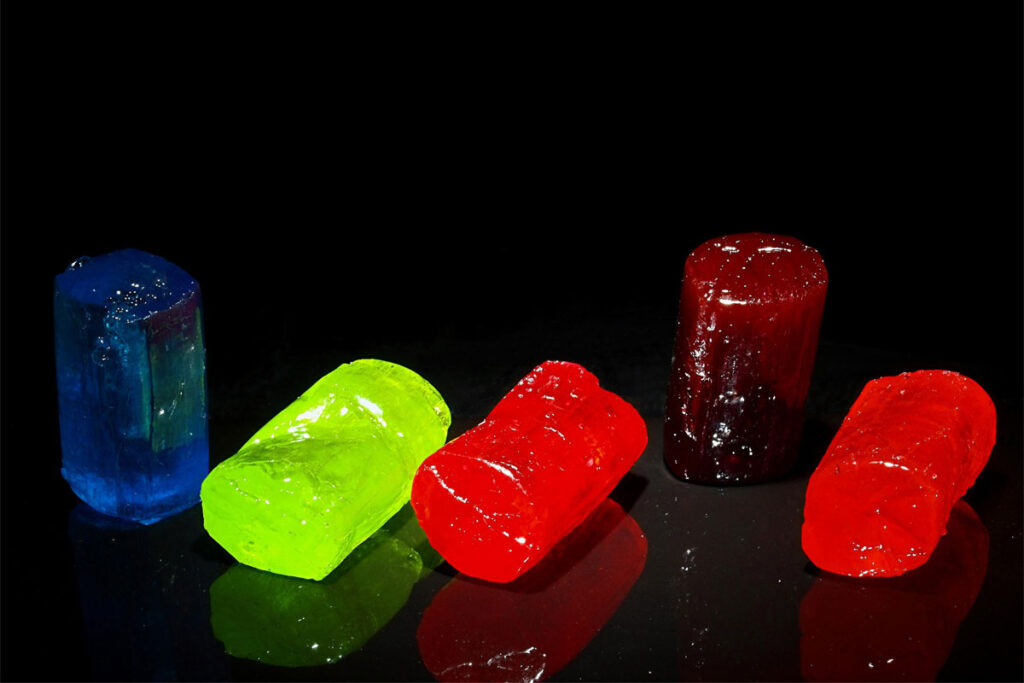 Jolly Rancher sweets are laid out against a black background.