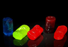 Jolly Rancher sweets are laid out against a black background.