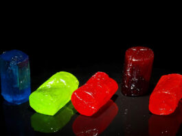 Jolly Rancher sweets are laid out against a black background.