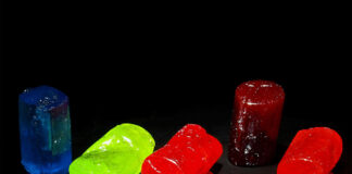Jolly Rancher sweets are laid out against a black background.