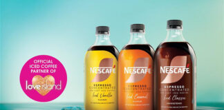 Promotional image of the Nescafé Espresso Concentrate range including Iced Vanilla, Iced Caramel and Iced Classic variants. The bottles are lined up next to each other with a reflective liquid surface underneath with a melting ice cube. There is also a pink circle stamp on the image highlighting the brand as the Official Iced Coffee Partner of Love Island. The Love Island logo is inside of the pink circle.