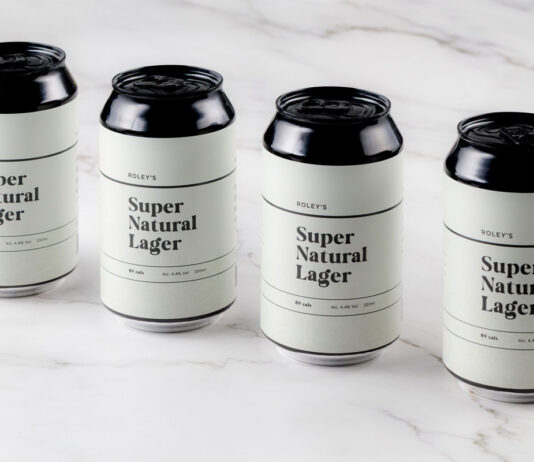 Love Drinks rolls out new Roley’s Super Natural Lager to its range Cans of Roley's Super Natural Lager stand on a marble worktop.