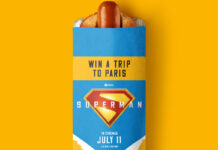 Rollover Hot Dog with branding on the top of it featuring Superman (2025) offering consumers the chance to win a trip to Paris.