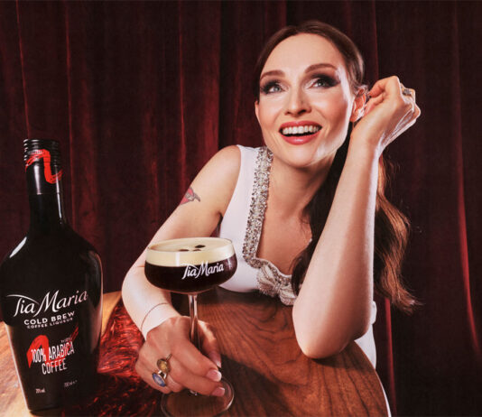 Tia Maria and Sophie Ellis-Bextor are set to Shake up the Taste Pop star Sophie Ellis-Bextor sits at a table with an Espresso Martini in hand with a bottle of Tia Maria Cold Brew next to the cocktail serve.