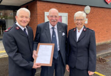 Sir Boyd Tunnock receiving his award from the Salvation Army