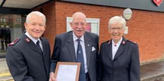 Sir Boyd Tunnock receiving his award from the Salvation Army