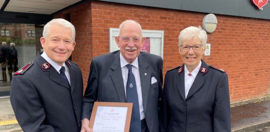 Sir Boyd Tunnock receiving his award from the Salvation Army