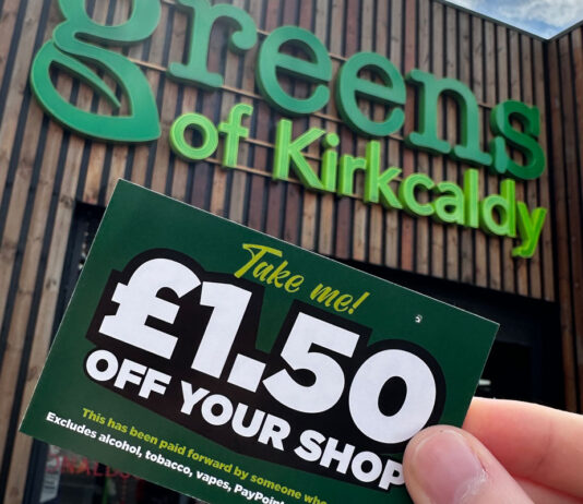 Greens Retail offers customers a discreet way to save on their shopping A person holds a £1.50 off voucher for use in Greens Retail stores outside of Greens of Kirkcaldy.