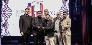Team members from IVG stand on a stage and accept the 'Innovation of the Decade' award at the Vapouround Global Awards 2025 in Dubai.
