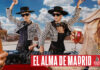 Promotional image for Madri Excepcional 2025 summer campaign with two women working on a DJ set whilst dancing, a person holds a Madri pint glass in the foreground with beer inside the glass.