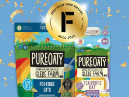 Pack shots of PureOaty Porridge Oats and PureOaty Tea-Riffic Oat Milk against blue background and golden confetti around it. The Gold award for the Free From Food Awards 2025.