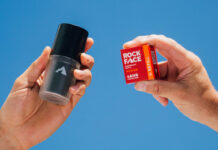 A person holds a Rock Face Deodorant Refillable container with a Rock Face Refillable Deodorant Power pack in the other hand.