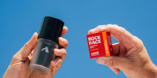 A person holds a Rock Face Deodorant Refillable container with a Rock Face Refillable Deodorant Power pack in the other hand.