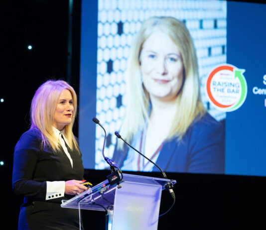 CJ Lang & Son appoints Sonya Harper as new chief operating officer Sonya Harper, chief operating officer at Spar Scotland, stands at a podium delivering a speech during the Spar Tradeshow event.