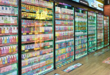 Glass cabinet of vaping products lined up against a store wall.