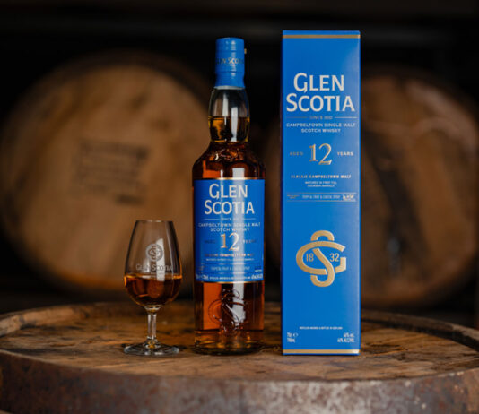 Glen Scotia flies the flagship with new 12 Year Old whisky A bottle of Glen Scotia 12 Year Old stands next to its outer box packaging with a dram of the whisky inside a nosing glass next to it. All three stand on top of a barrel.