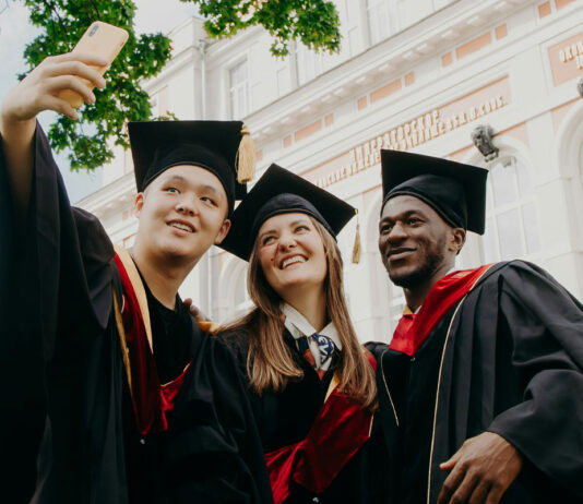 Leverhulme Trade Charities Trust opens up applications for 2025/26 university undergraduate grants Three university graduates stand together taking a selfie.