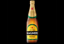 Bottle of 2025 redesign for Magners cider against a black background.