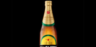 Bottle of 2025 redesign for Magners cider against a black background.