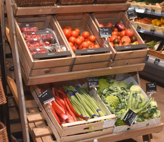 Food inflation sees no reprieve in ONS figures Fresh fruit and veg display making use of wooden boxes.