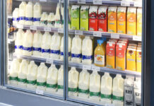 A store chiller filled with milk drink products, fruit juices and milk alternative options.