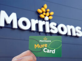 Morrisons launches new promotion for Daily stores A person holds up a Morrisons More card against a Morrisons sign which is on a building with black panelling.