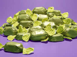 Quality Street introduces new Mystery Flavour for Christmas A pile of green wrapper chocolates for Quality Street boxes, the chocolate's flavour is to remain a mystery until December 2025.