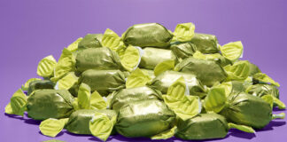 A pile of green wrapper chocolates for Quality Street boxes, the chocolate's flavour is to remain a mystery until December 2025.