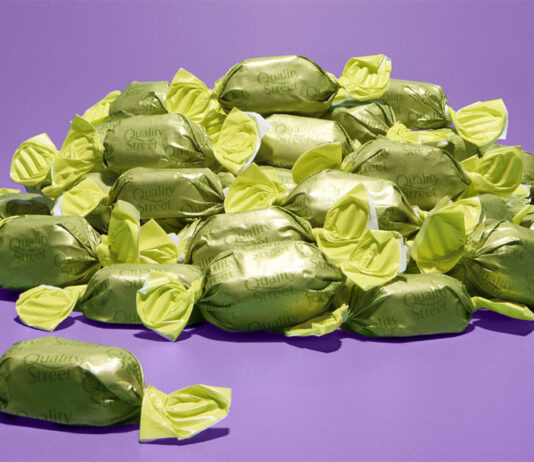 Quality Street introduces new Mystery Flavour for Christmas A pile of green wrapper chocolates for Quality Street boxes, the chocolate's flavour is to remain a mystery until December 2025.
