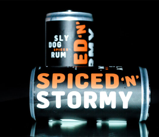 Sly Dog Rum expands RTD market with Dark ‘n’ Stormy cans Cans of Sly Dog Rum Spiced 'n' Stormy cans against a black background.