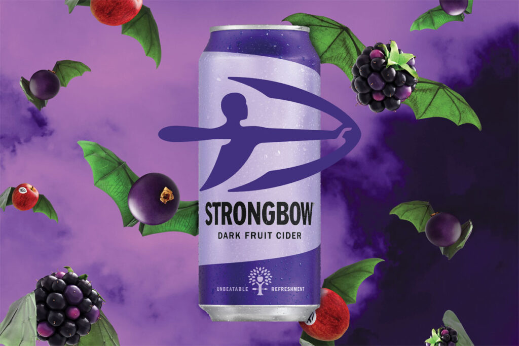 Halloween advert for Strongbow cider featuring its Dark Fruit variant with fruit in the background that have jaggy leaves attached made to look like bat wings.