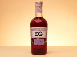 Edinburgh Gin unveils new Black Forest Gateau liqueur A bottle of Edinburgh Gin Black Forest Gateau Liqueur stands against a lit up background.