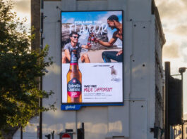Estrella Galicia launches UK campaign and new format to build on growth An electronic billboard on the side of a building has the winter 2025 campaign for Estrella Galicia on it.
